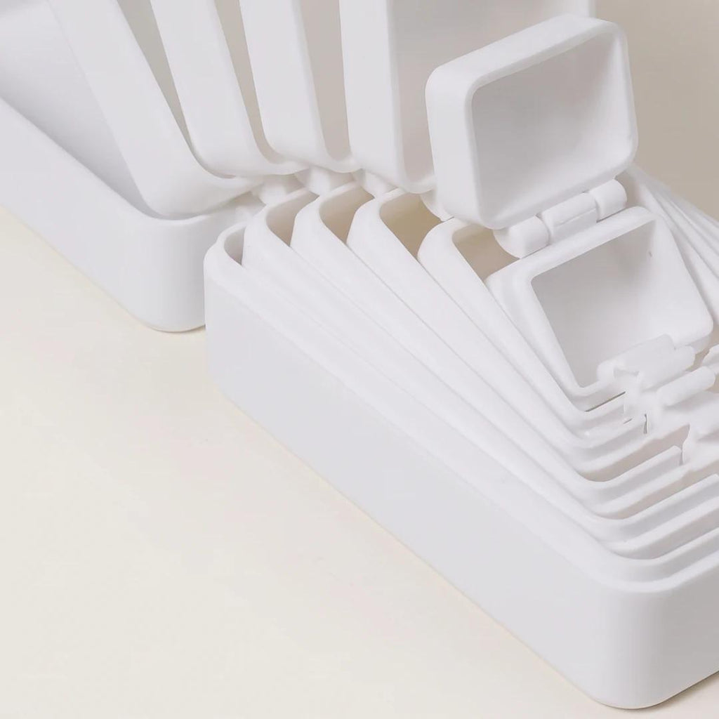 Close detail of the open White nesting lids and hinges